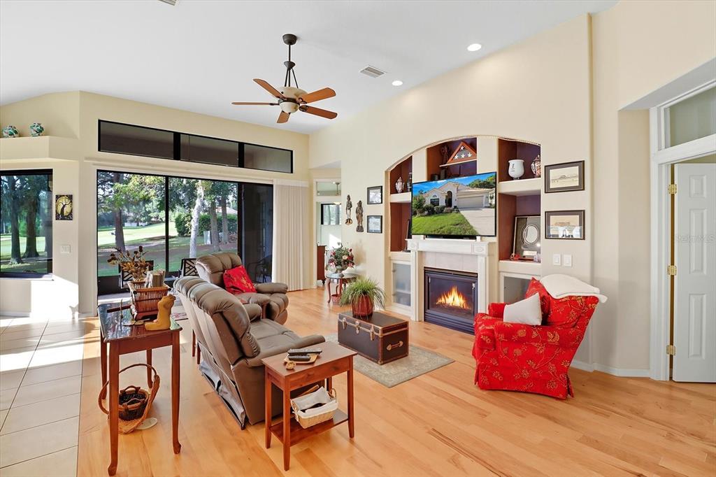 366 West Doerr Path Hernando, FL 34442 - Photo 8 of 47 a living room with fireplace furniture and a large window