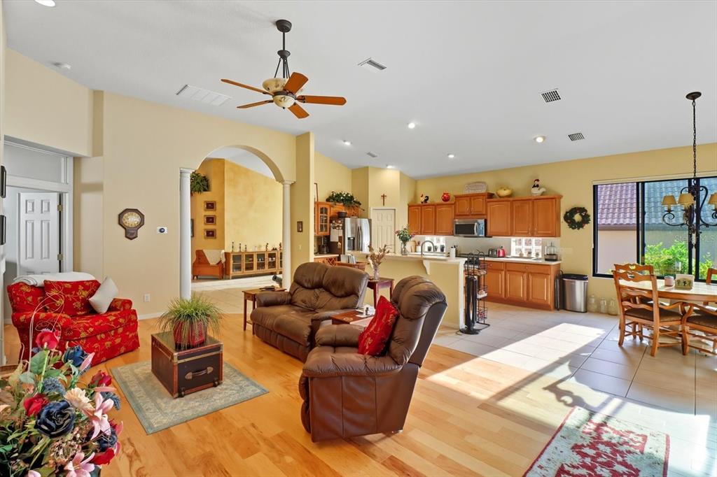 366 West Doerr Path Hernando, FL 34442 - Photo 10 of 47 a living room with lots of furniture and a chandelier