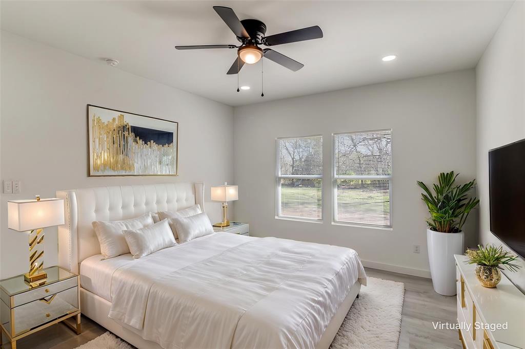 3108 Delafield Lane Dallas, TX 75227 - Photo 16 of 30 a bedroom with a large bed and a window