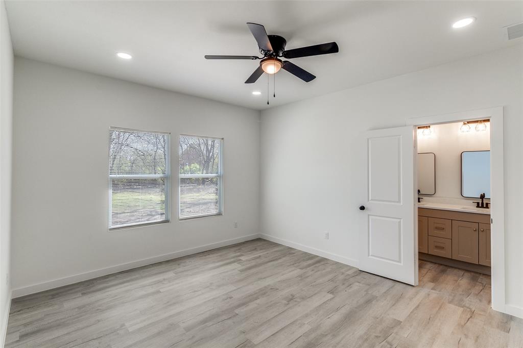 3108 Delafield Lane Dallas, TX 75227 - Photo 18 of 30 a view of an empty room with a window