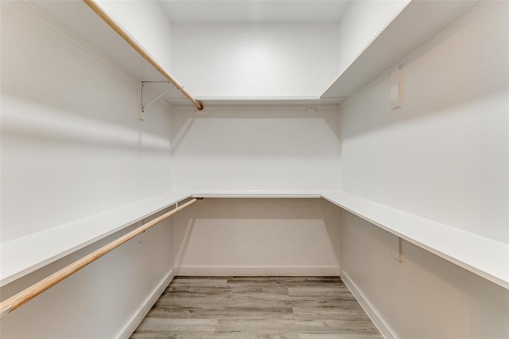 3108 Delafield Lane Dallas, TX 75227 - Photo 20 of 30 a view of a room with wooden floor