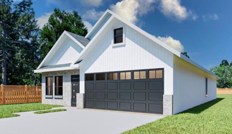 3108 Delafield Lane Dallas, TX 75227 - Photo 2 of 7 a front view of a house with a yard and garage