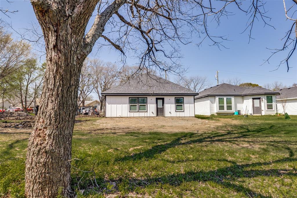 3108 Delafield Lane Dallas, TX 75227 - Photo 29 of 30 a front view of a house with garden