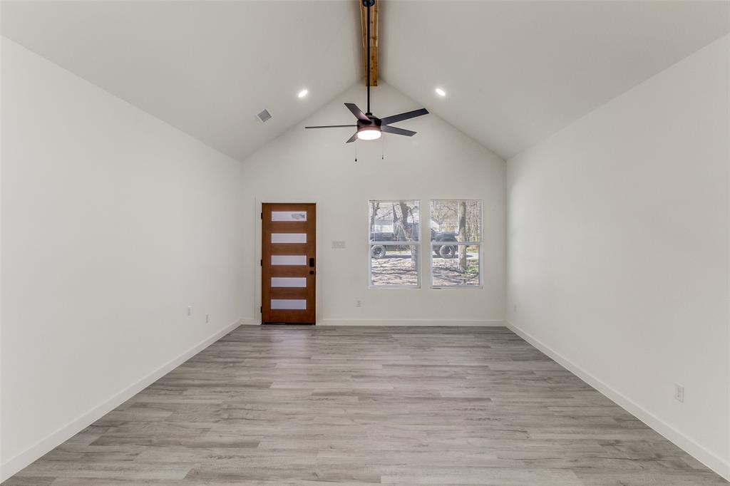 3108 Delafield Lane Dallas, TX 75227 - Photo 4 of 30 a view of an empty room with a window