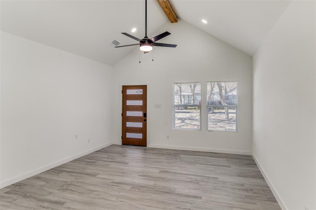 3108 Delafield Lane Dallas, TX 75227 - Photo 5 of 30 wooden floor in an empty room with a window