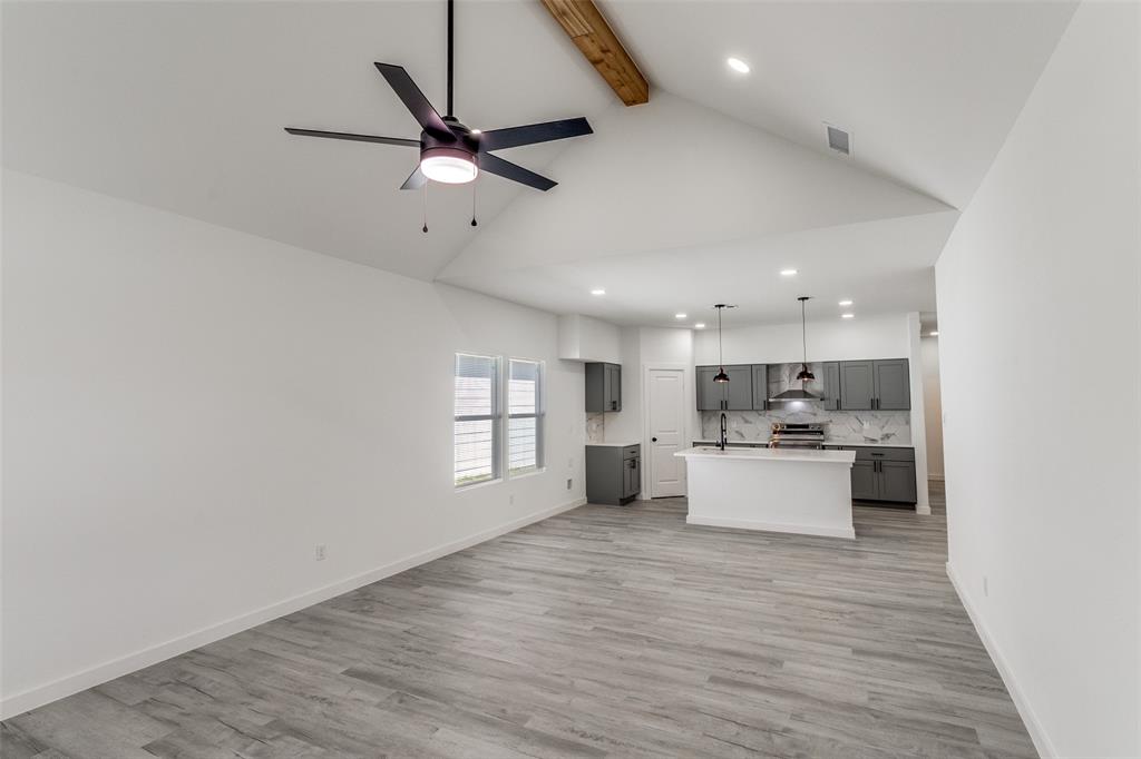 3108 Delafield Lane Dallas, TX 75227 - Photo 9 of 30 a view of a kitchen with a sink cabinets and wooden floor