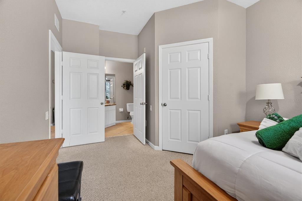 7664 Comrow Street, Unit 304 Kissimmee, FL 34747 - Photo 14 of 42 a bedroom with a bed and a couch