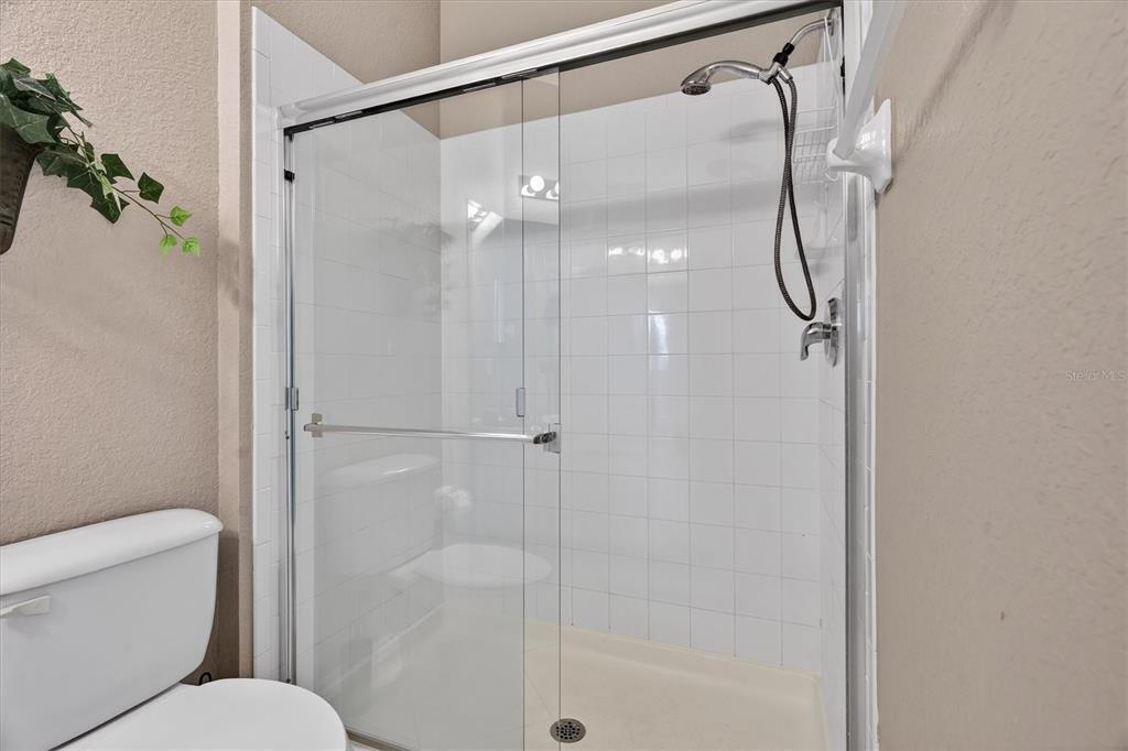 7664 Comrow Street, Unit 304 Kissimmee, FL 34747 - Photo 16 of 42 a bathroom with a shower and toilet