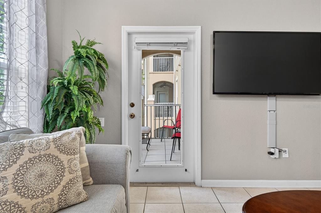 7664 Comrow Street, Unit 304 Kissimmee, FL 34747 - Photo 25 of 42 a living room with furniture