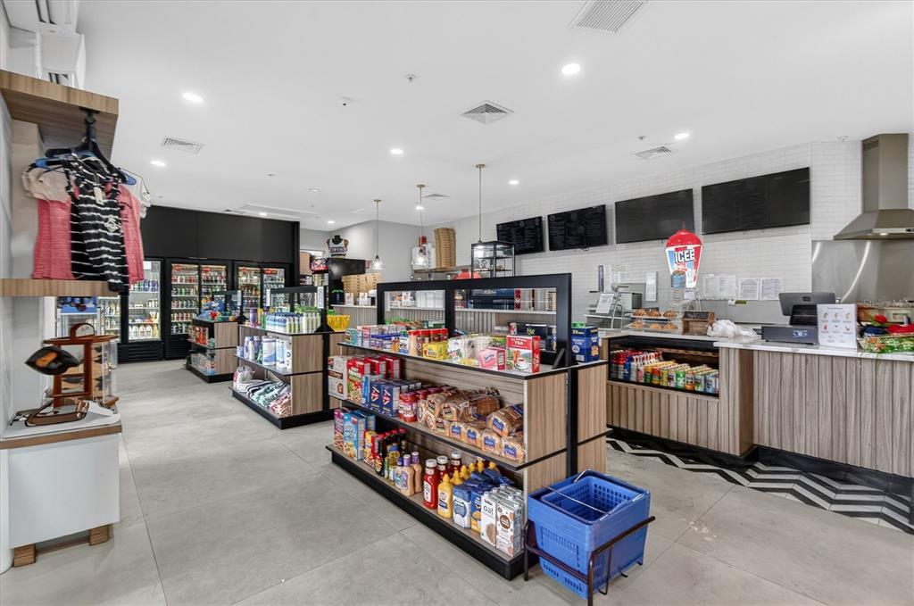 7664 Comrow Street, Unit 304 Kissimmee, FL 34747 - Photo 32 of 42 a kitchen with stainless steel appliances kitchen island granite countertop a stove and a sink