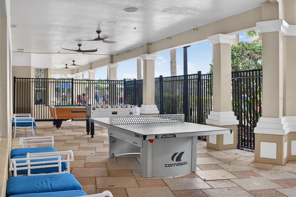 7664 Comrow Street, Unit 304 Kissimmee, FL 34747 - Photo 33 of 42 a view of kitchen with granite countertop a couch and a stove