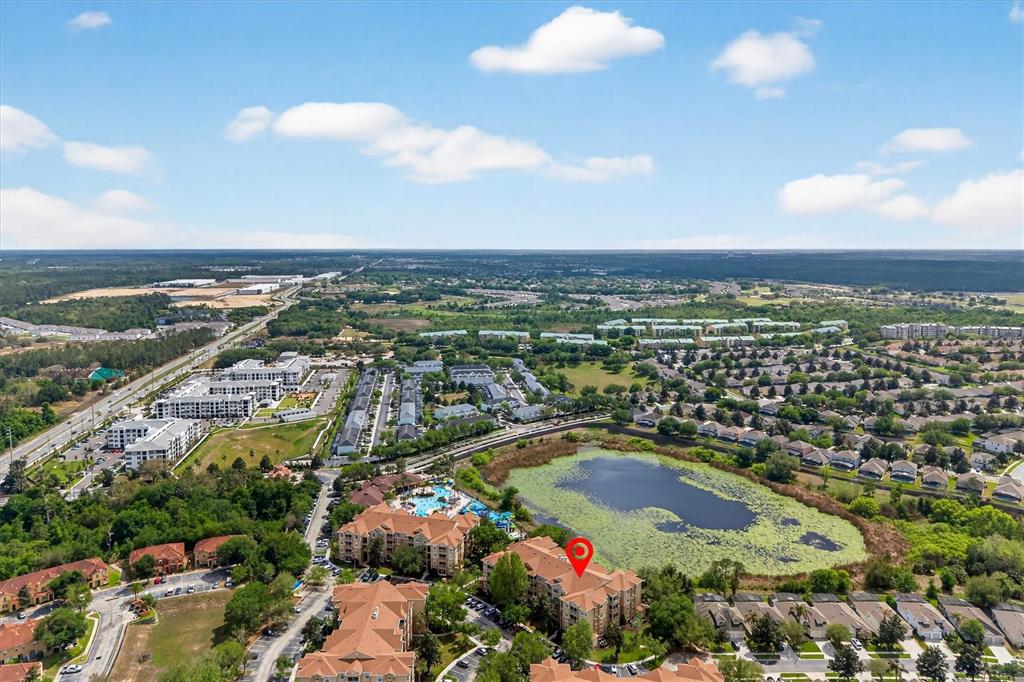 7664 Comrow Street, Unit 304 Kissimmee, FL 34747 - Photo 40 of 42 an aerial view of residential building and ocean view
