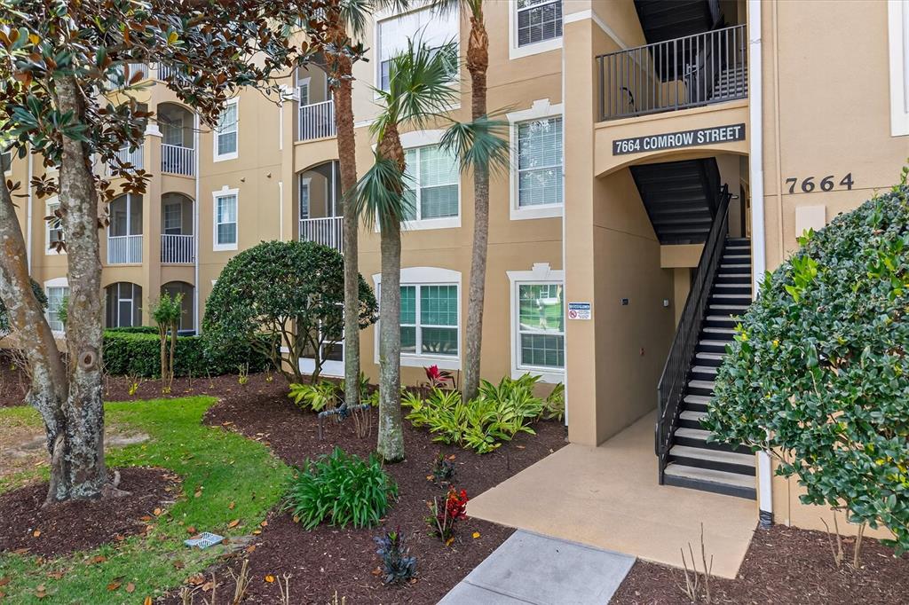 7664 Comrow Street, Unit 304 Kissimmee, FL 34747 - Photo 4 of 42 a view of a house with a garden