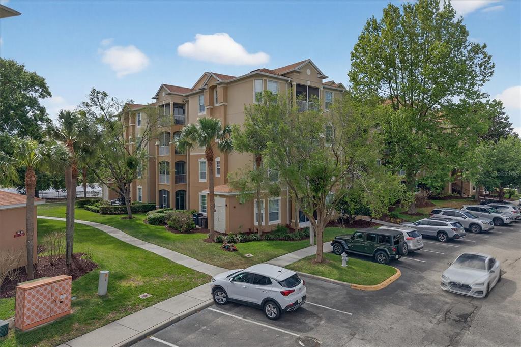 7664 Comrow Street, Unit 304 Kissimmee, FL 34747 - Photo 41 of 42 a white house that has sitting in the middle of a park