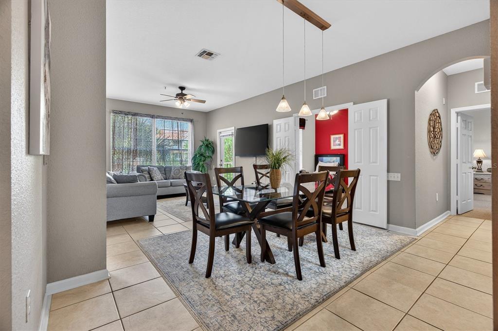 7664 Comrow Street, Unit 304 Kissimmee, FL 34747 - Photo 7 of 42 a dining room with furniture and window