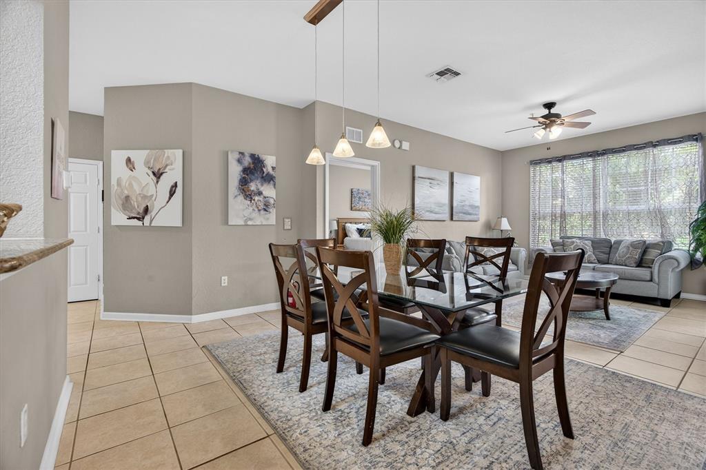 7664 Comrow Street, Unit 304 Kissimmee, FL 34747 - Photo 8 of 42 a view of a dining room with furniture