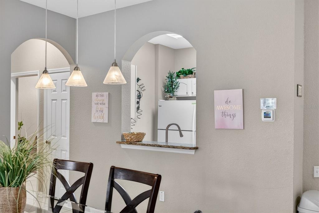 7664 Comrow Street, Unit 304 Kissimmee, FL 34747 - Photo 9 of 42 a view of kitchen with furniture and wooden floor