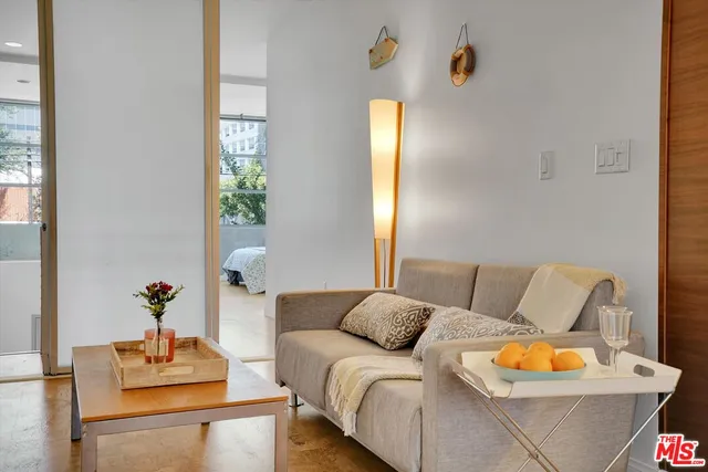 a living room with furniture and lamp