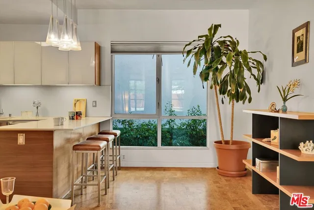 a kitchen with a table and chairs in it