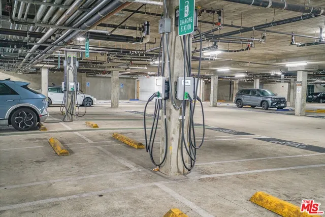 a view of parking garage with cars