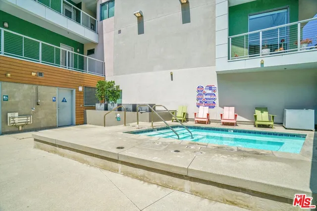 a backyard of a house with barbeque oven and outdoor seating