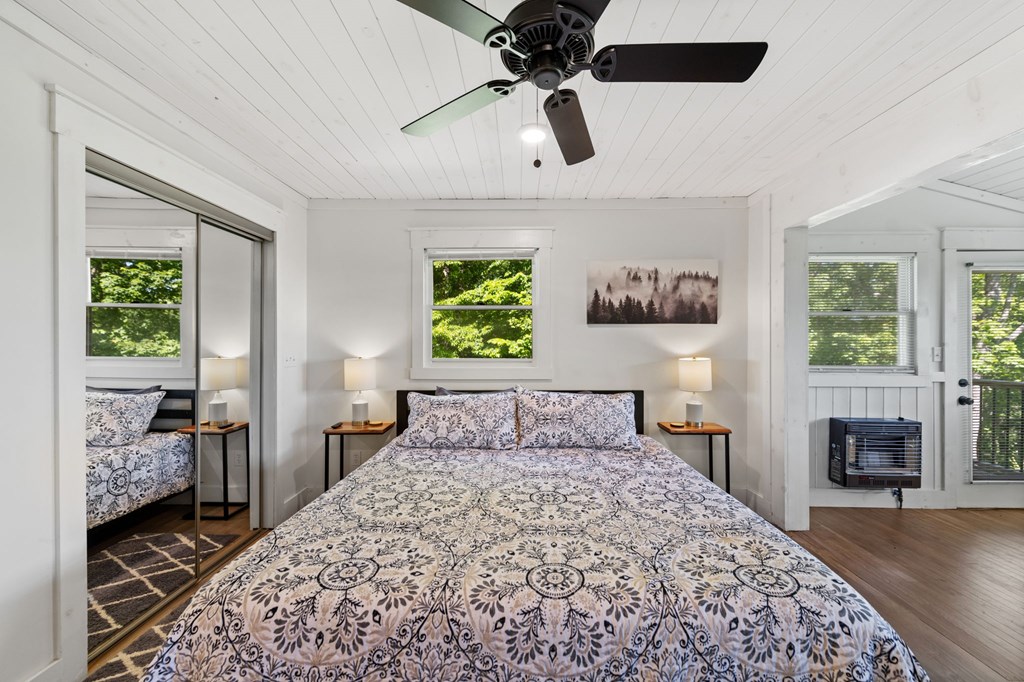760 River Bend Lane Blue Ridge, GA 30513 - Photo 35 of 101 a bedroom with a bed and a fireplace