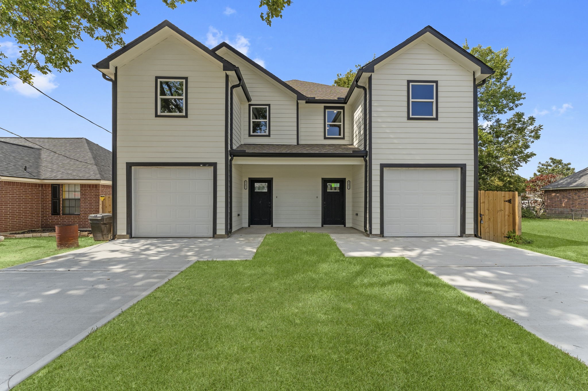 8205 Carver Road Houston, TX 77088 - Photo 1 of 37 a front view of a house with a yard and garage