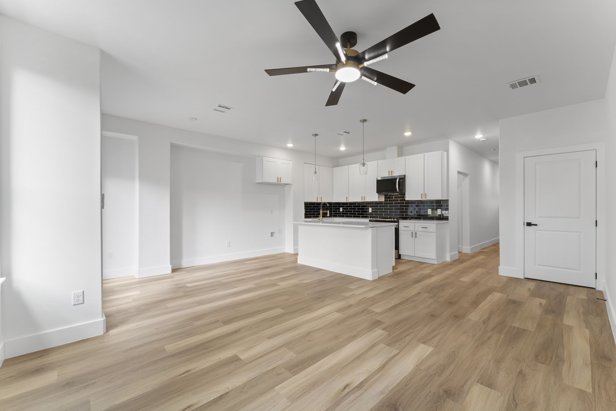 8205 Carver Road Houston, TX 77088 - Photo 14 of 37 a view of kitchen with refrigerator and microwave