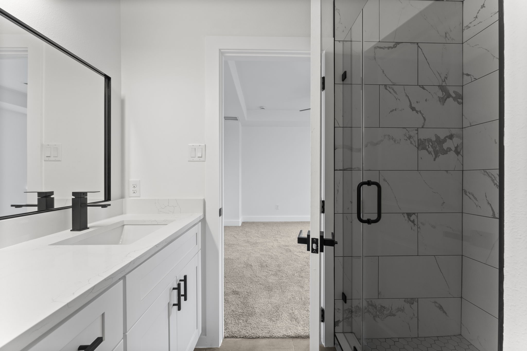 8205 Carver Road Houston, TX 77088 - Photo 19 of 37 a bathroom with a sink vanity granite shower and a mirror