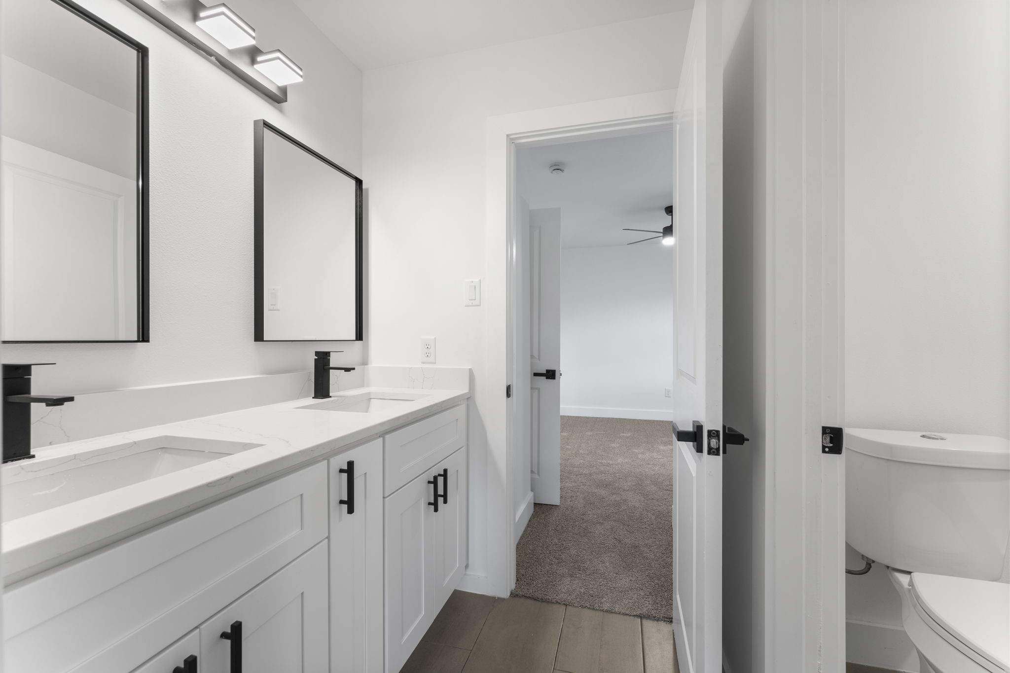 8205 Carver Road Houston, TX 77088 - Photo 22 of 37 a bathroom with a sink and mirror with toilet