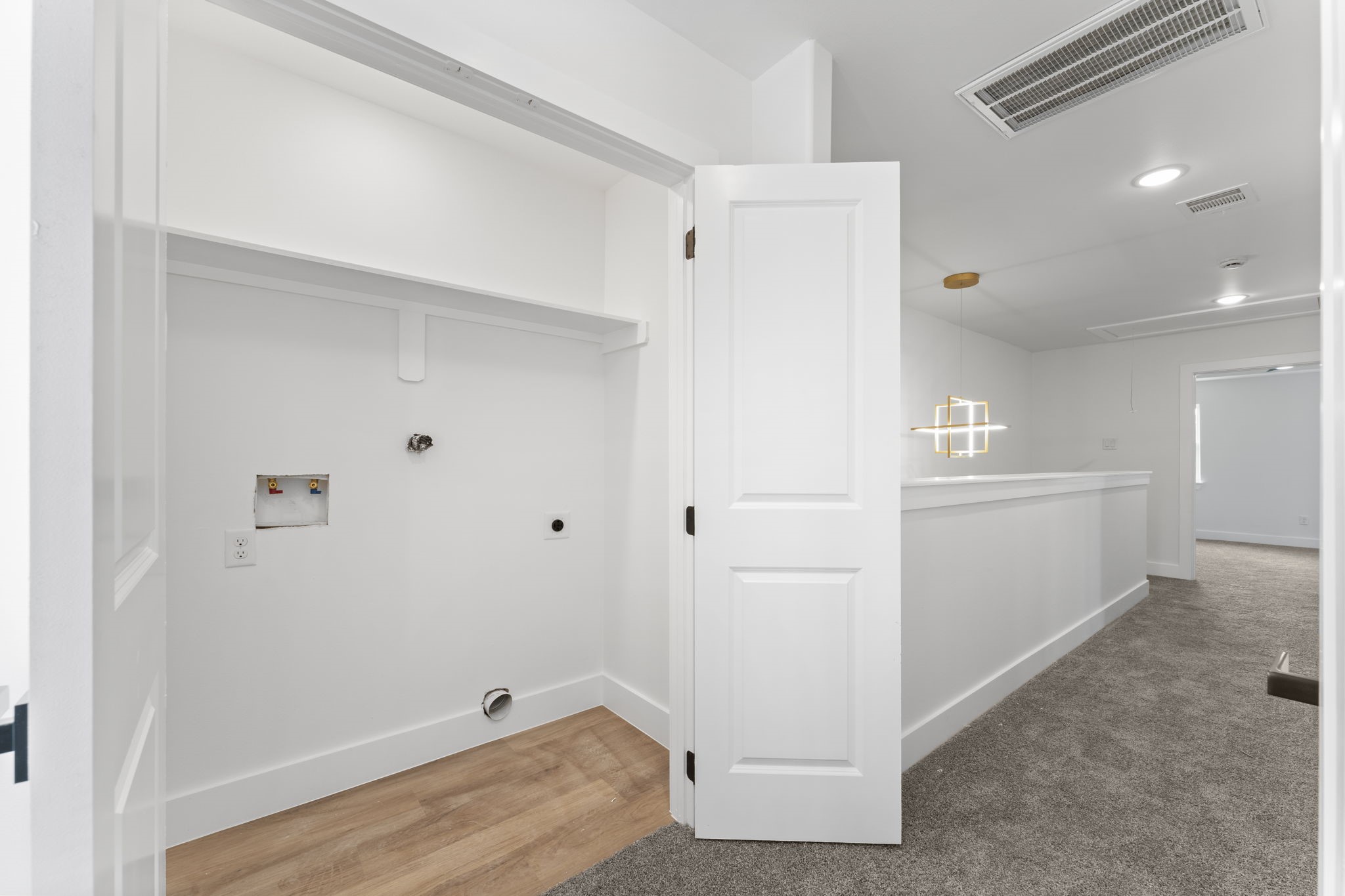 8205 Carver Road Houston, TX 77088 - Photo 26 of 37 a view of room with hardwood floor and hallway