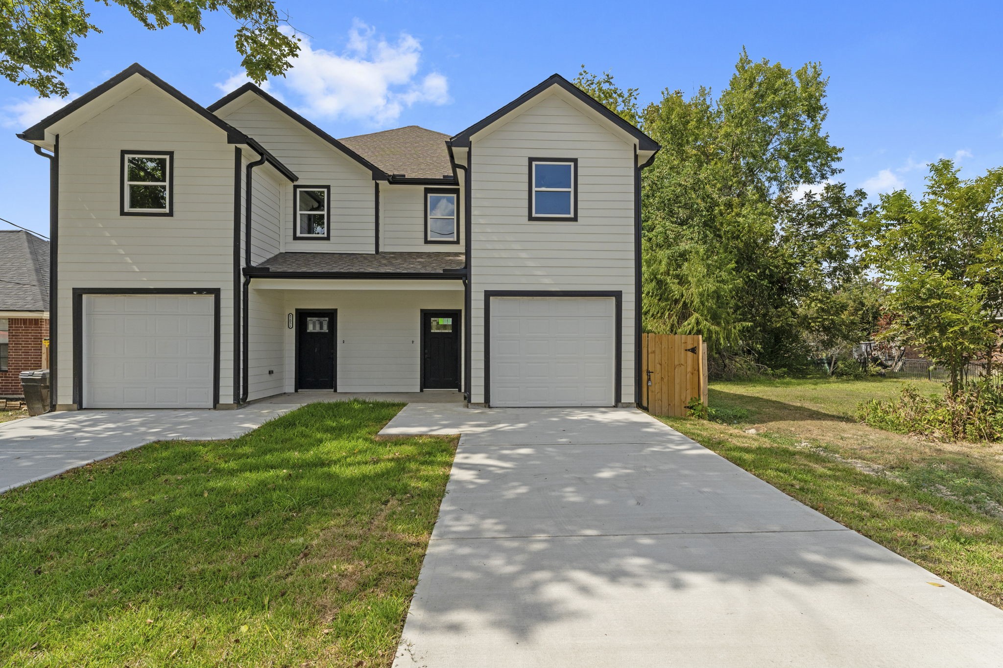 8205 Carver Road Houston, TX 77088 - Photo 31 of 37 a front view of a house with a yard and garage