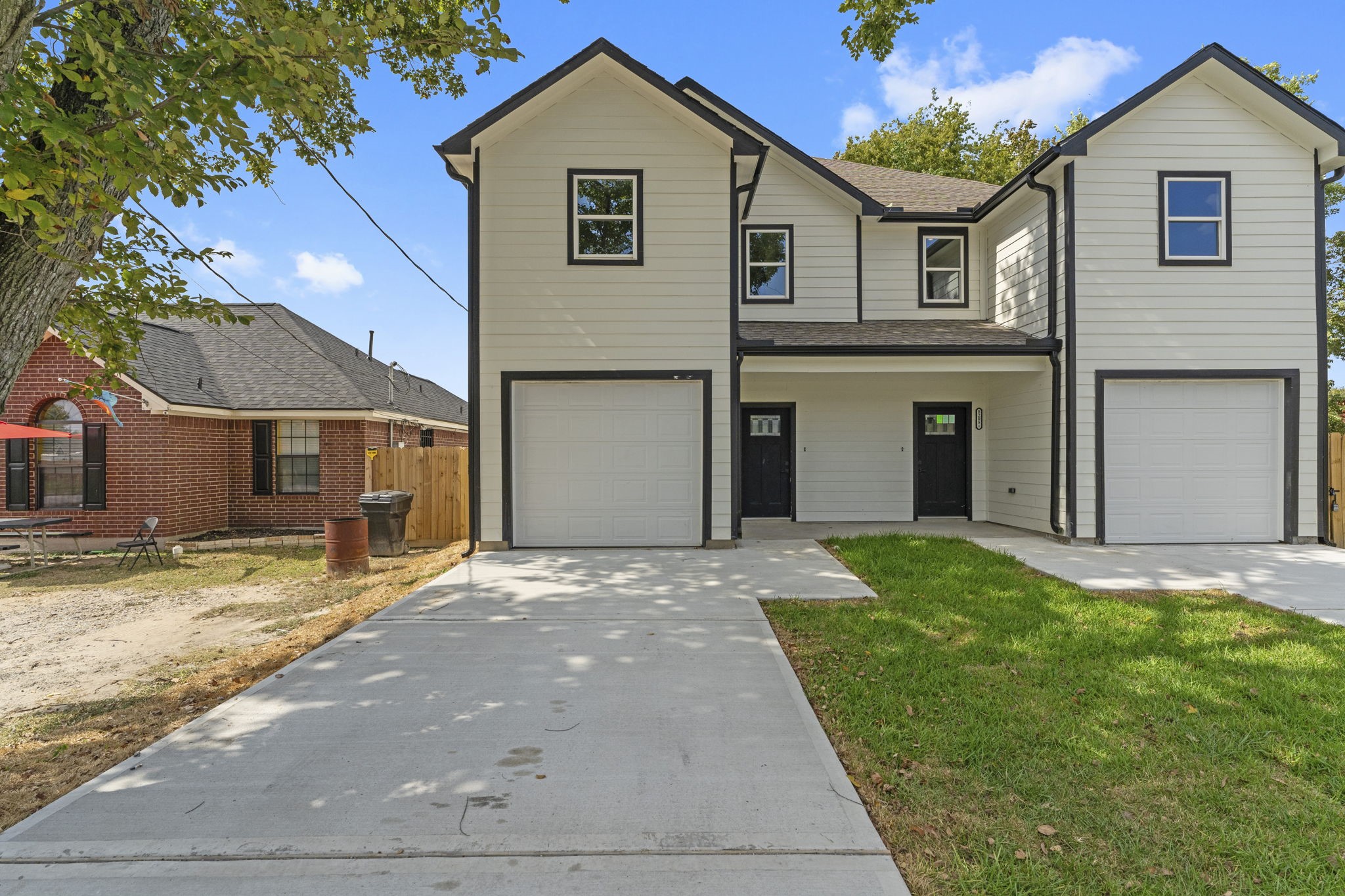 8205 Carver Road Houston, TX 77088 - Photo 34 of 37 a front view of a house with a yard and garage