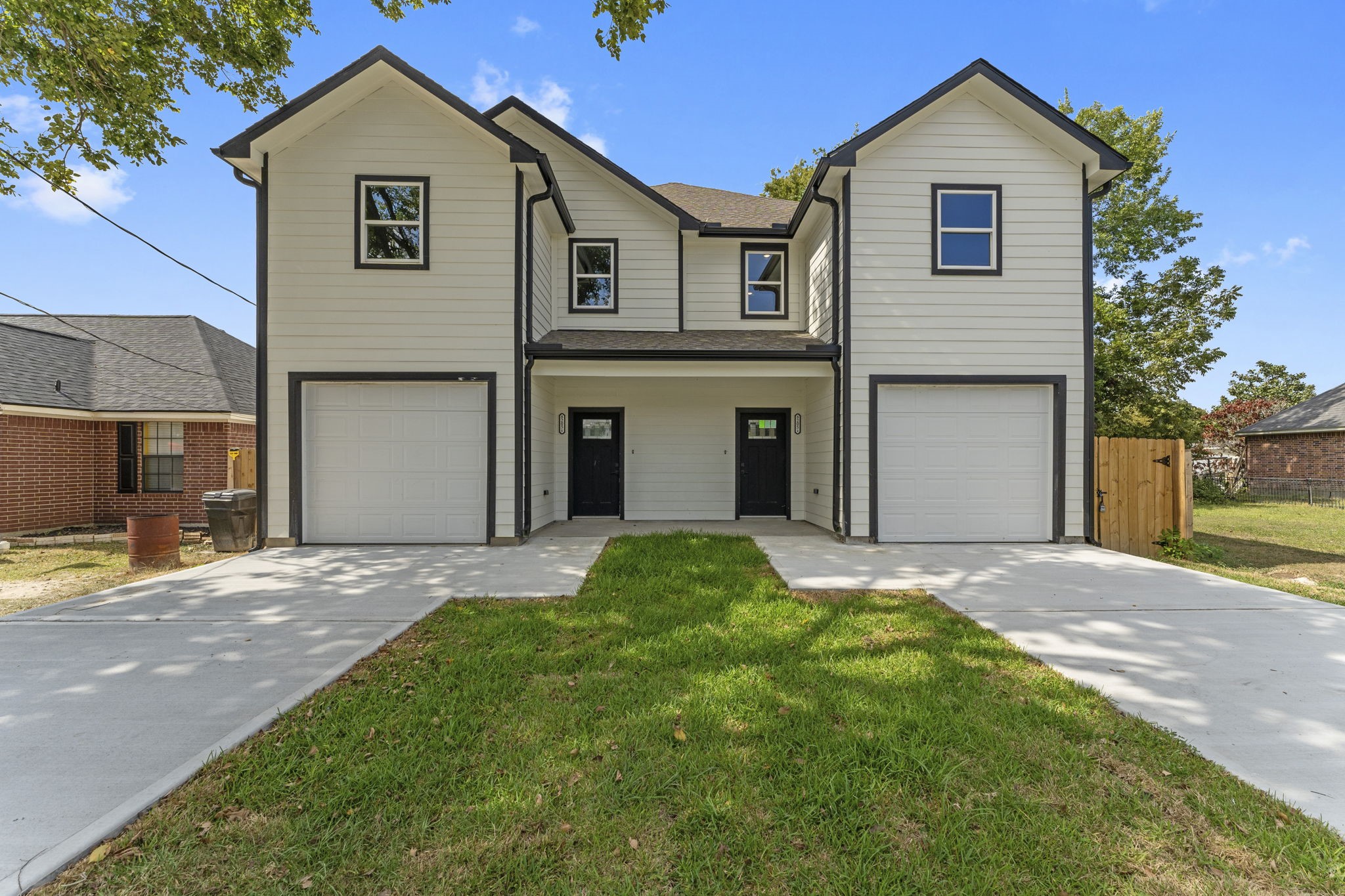8205 Carver Road Houston, TX 77088 - Photo 35 of 37 a front view of a house with a yard and garage