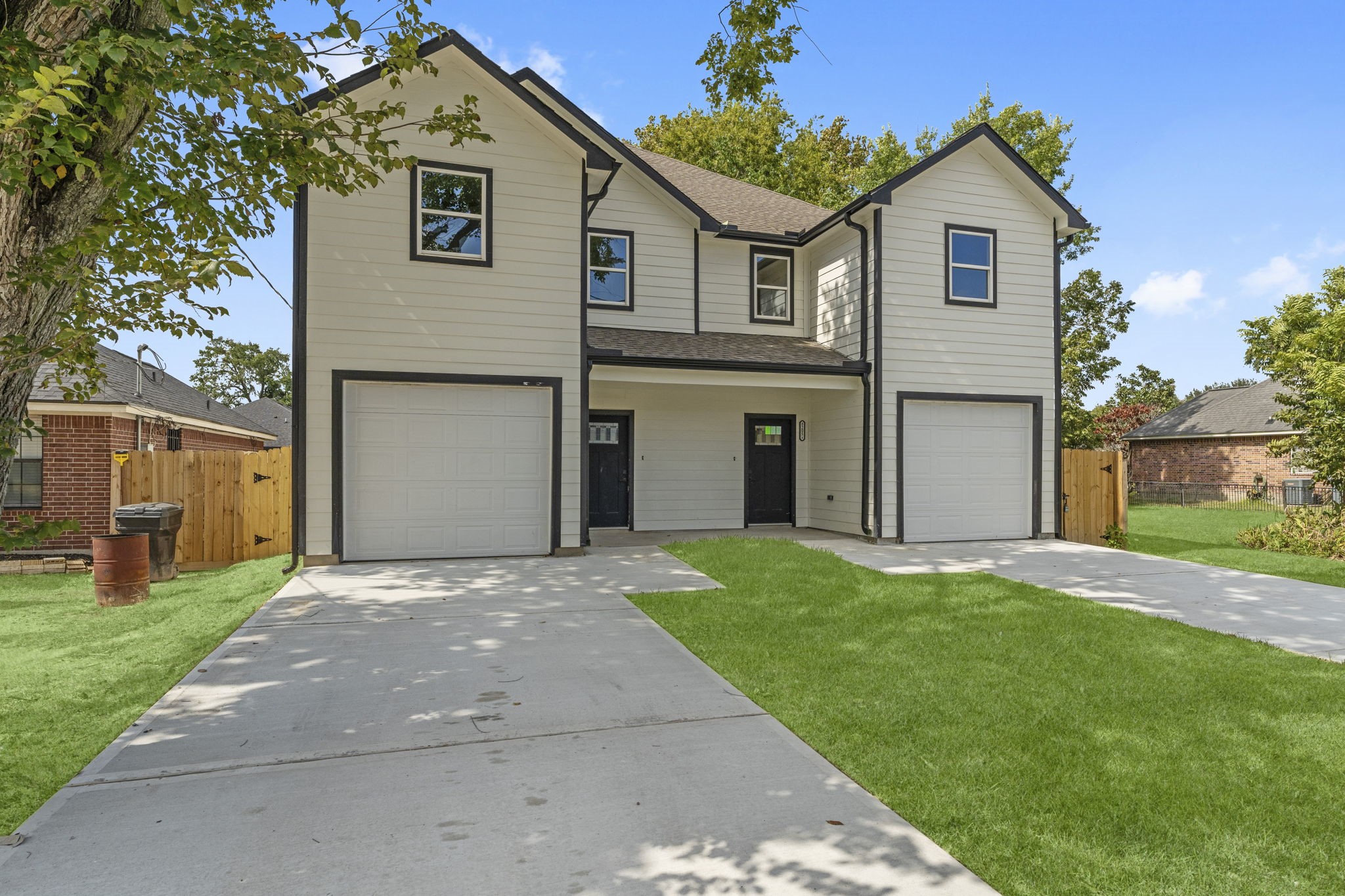 8205 Carver Road Houston, TX 77088 - Photo 4 of 37 a front view of a house with a yard and garage