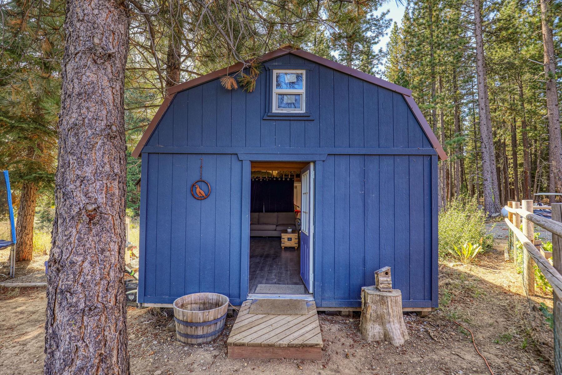 1015 Mountain Quail Road Calpine, CA 96124 - Photo 18 of 24 a front view of a house with garden