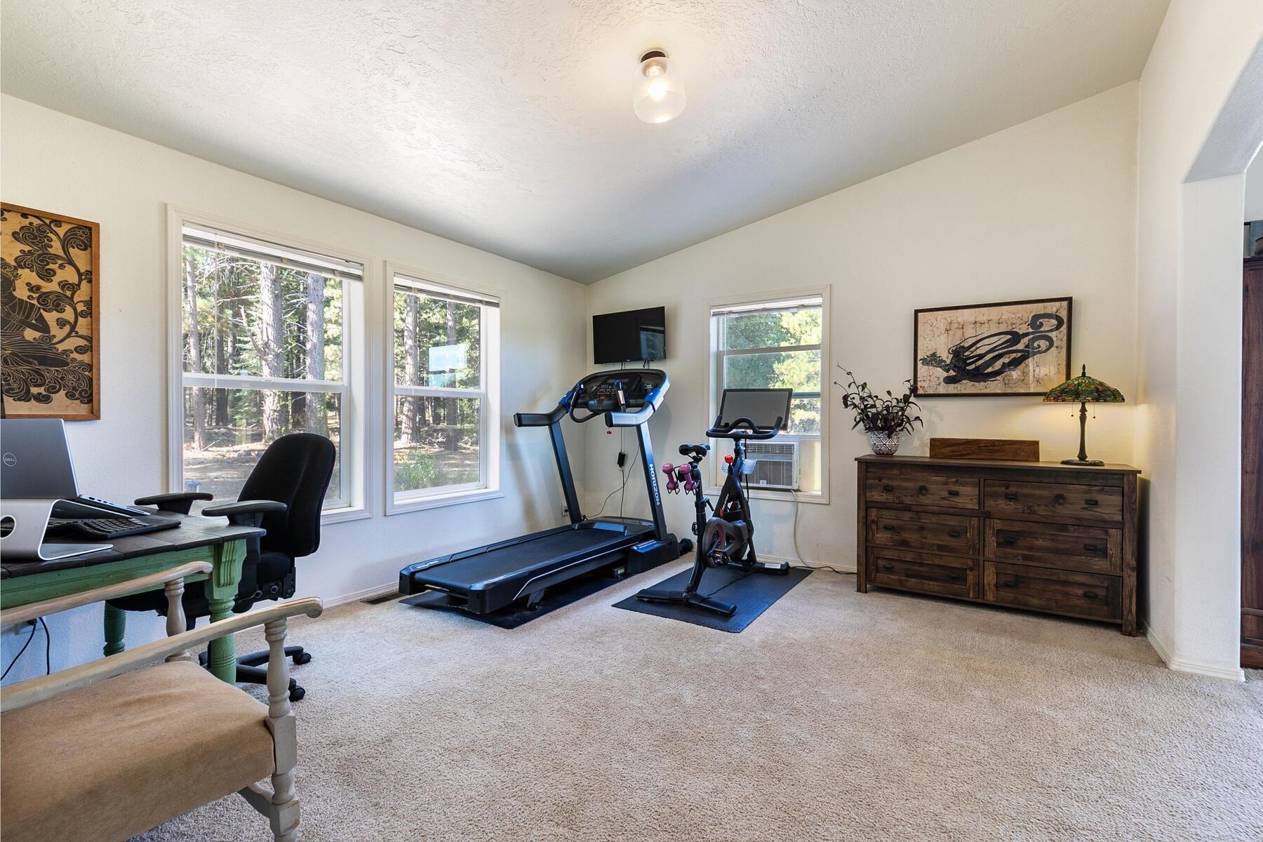 1015 Mountain Quail Road Calpine, CA 96124 - Photo 24 of 24 a view of a workspace with furniture and a window