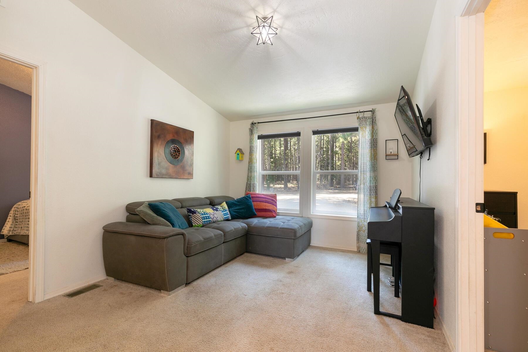 1015 Mountain Quail Road Calpine, CA 96124 - Photo 8 of 24 a living room with furniture and a window
