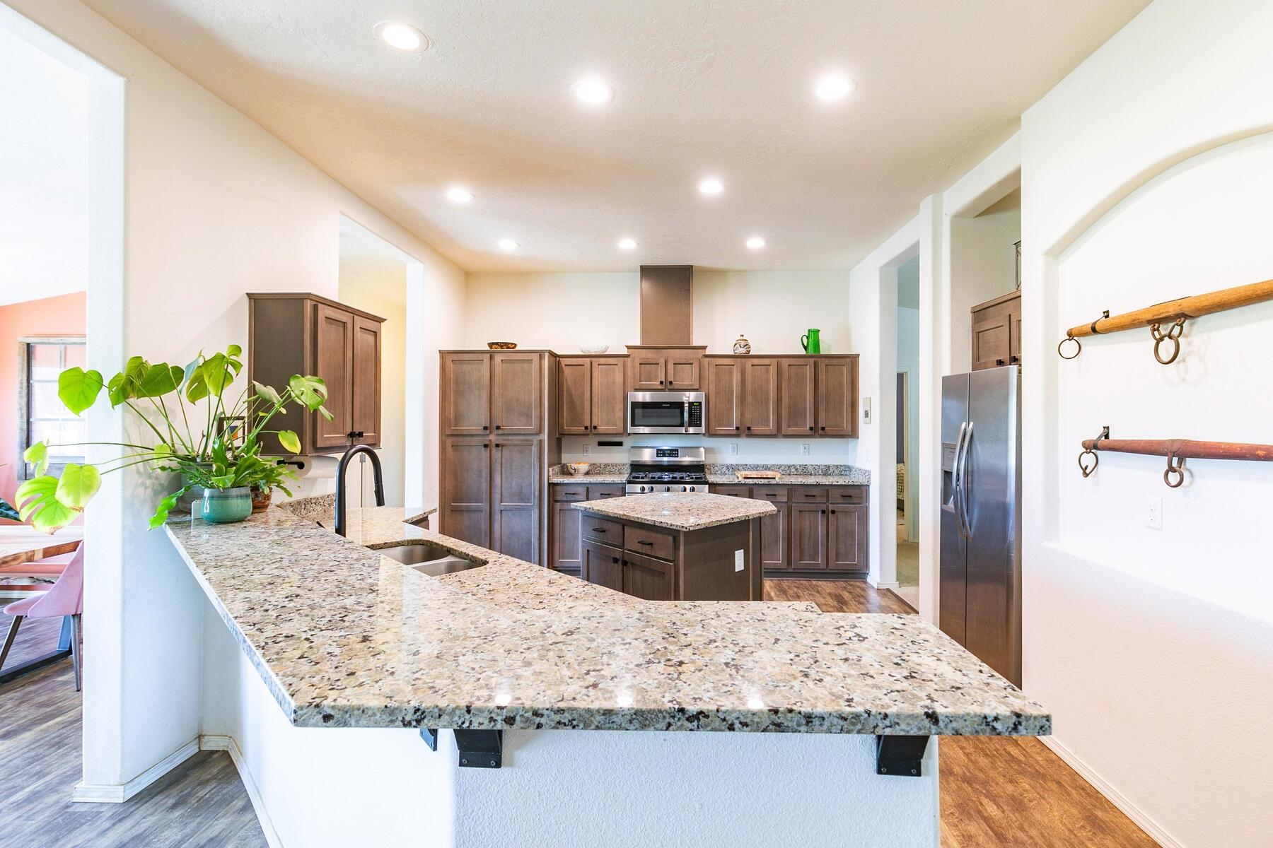 1015 Mountain Quail Road Calpine, CA 96124 - Photo 10 of 24 a kitchen with kitchen island granite countertop a refrigerator and stove