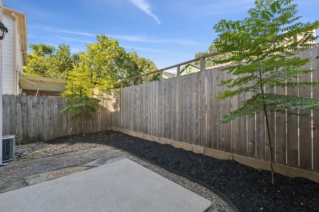 a backyard of a house with lots of green space