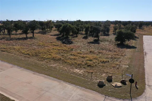 a view of outdoor space with green field and trees