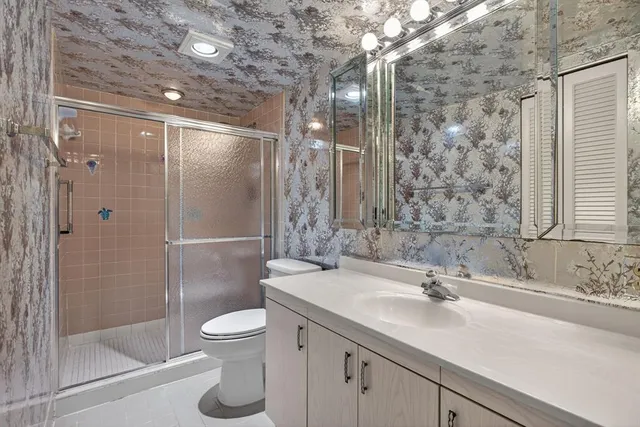 a view of a living room and kitchen