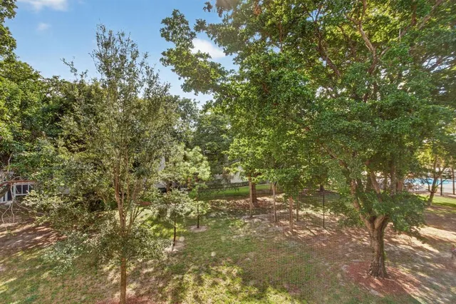 a open kitchen with stainless steel appliances granite countertop a stove top oven table and chairs