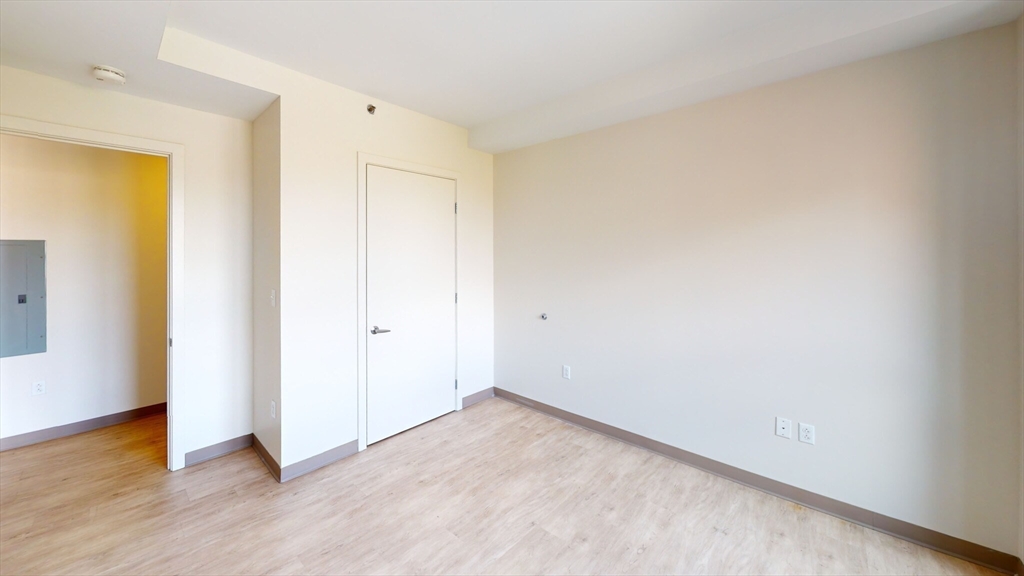 225 Centre Street, Unit 409 Boston, MA 02119 - Photo 5 of 9 a view of an empty room