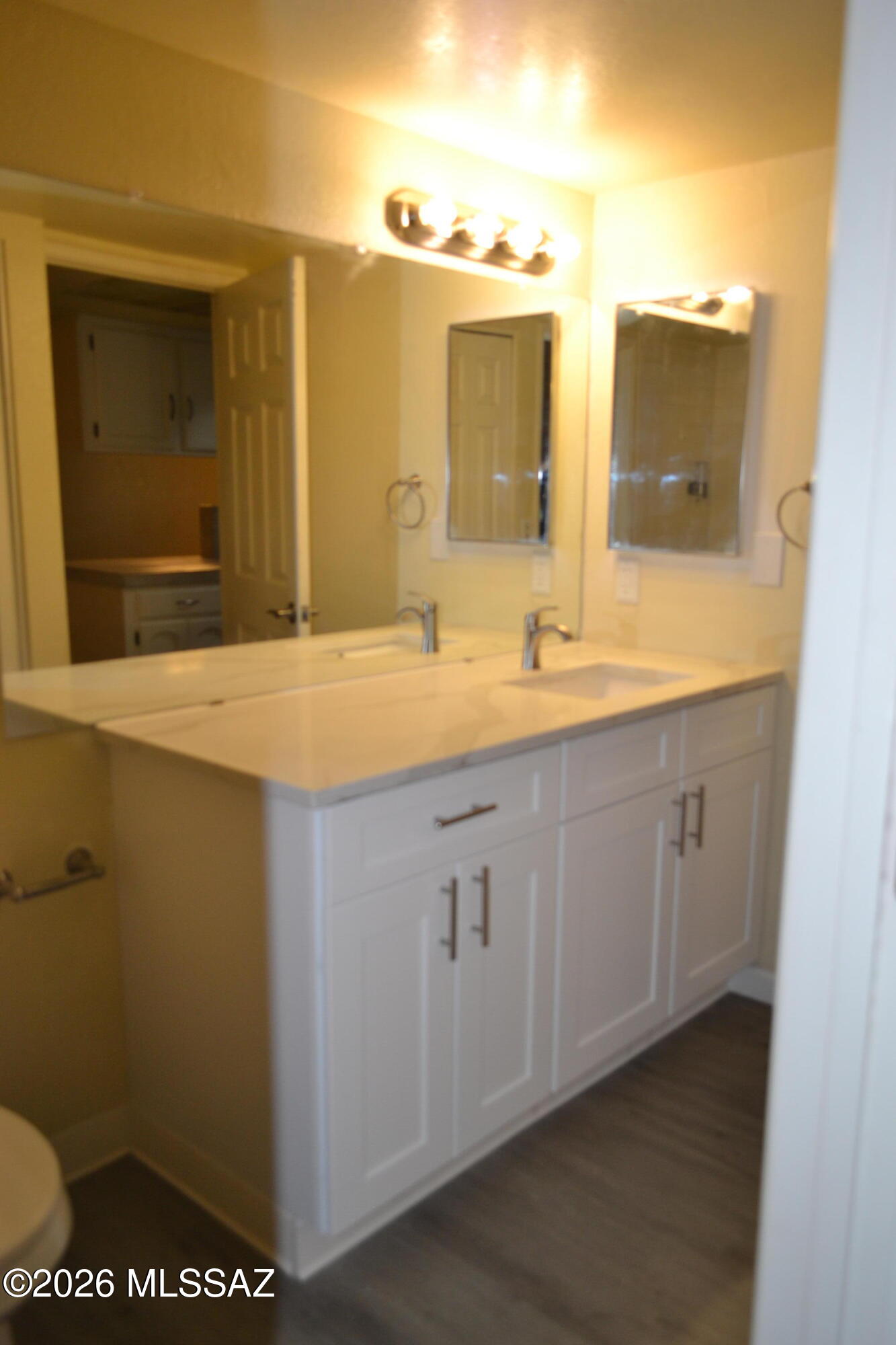 1200 East River Road, Unit D47 Tucson, AZ 85718 - Photo 12 of 13 a bathroom with a sink and a mirror