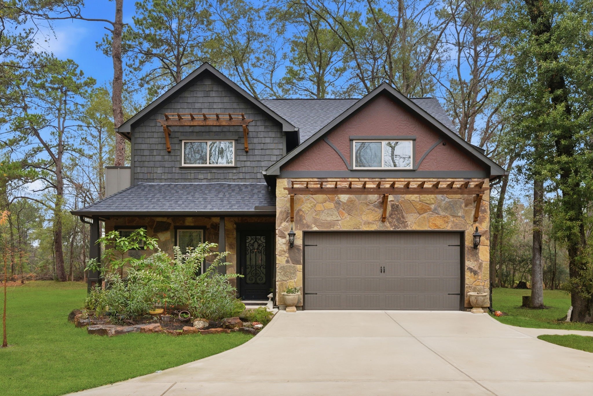 a front view of a house with garden