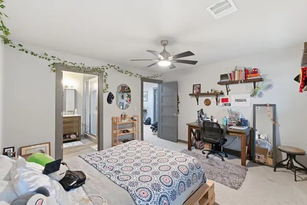 a bedroom with a bed and furniture