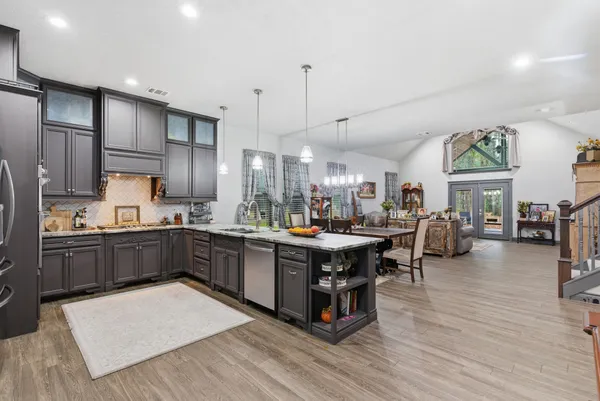a kitchen with stainless steel appliances granite countertop lots of counter top space