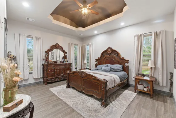 a living room with a bed furniture and a window