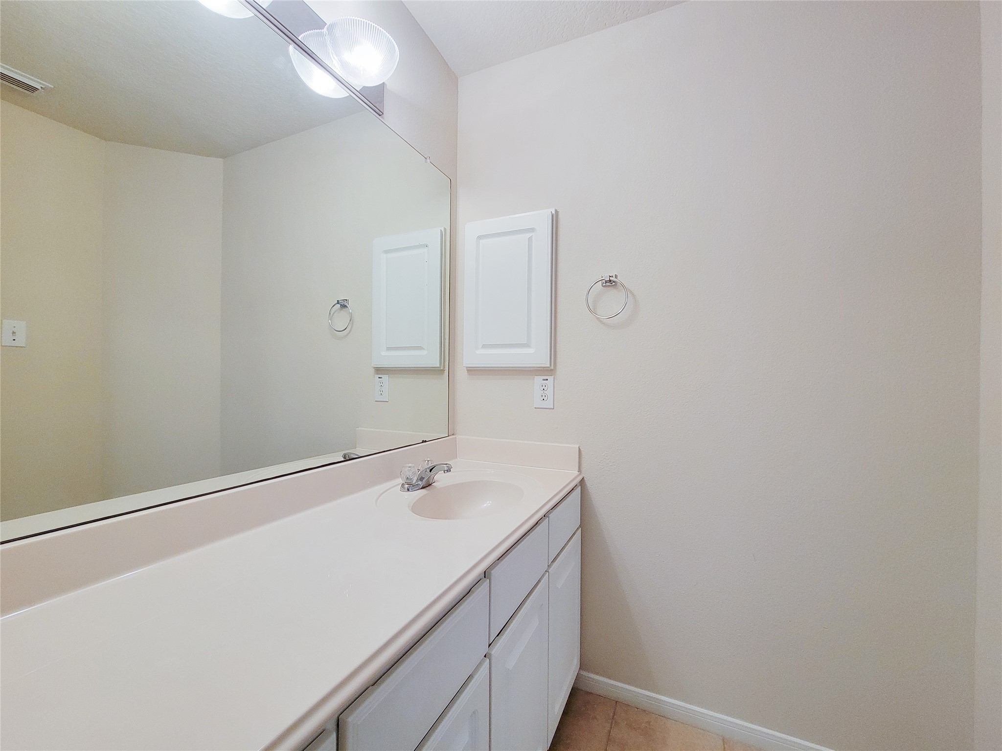 19330 Harvest Stream Way Houston, TX 77084 - Photo 35 of 50 a bathroom with a sink and a mirror